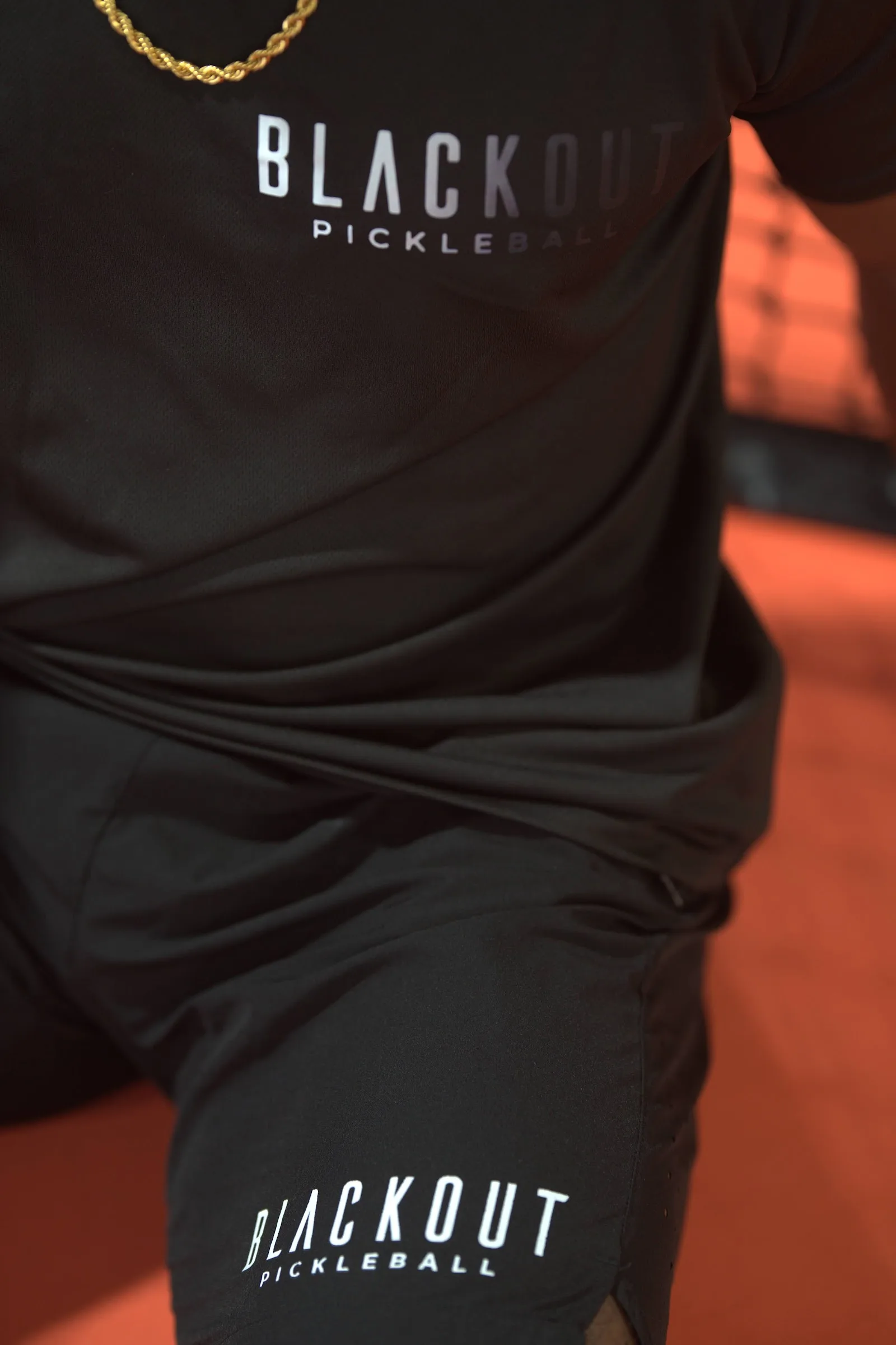Blackout Pickleball athlete in branded gear on the court