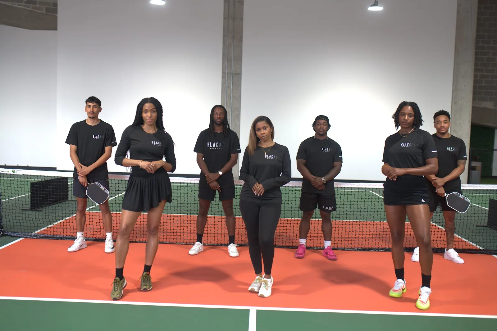 The Blackout Pickleball team — seven athletes at the net