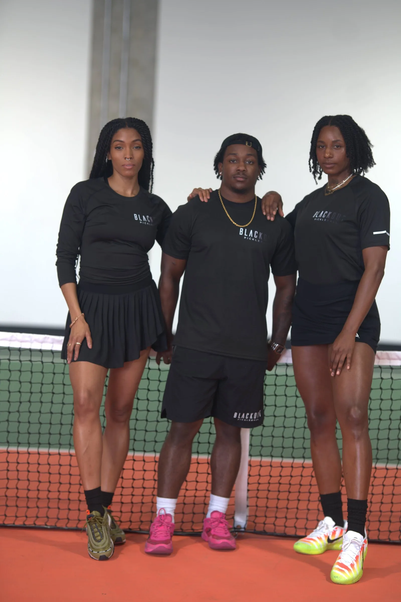 Blackout Pickleball athlete — styled portrait with paddle
